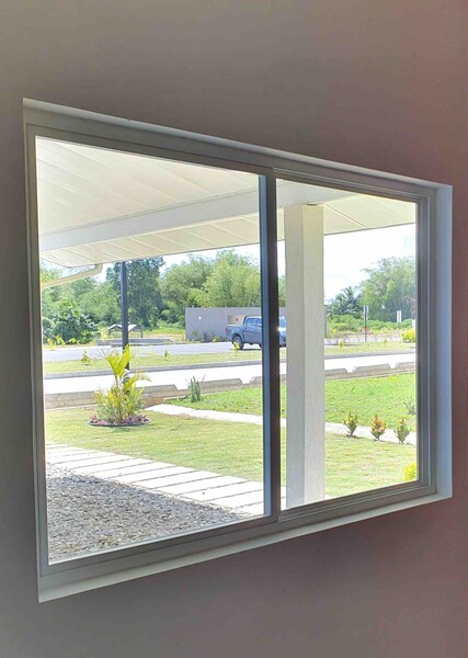 Domuv awning operator openings on a Caribbean elevation